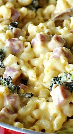 macaroni with ham and broccoli in a red bowl