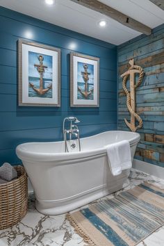 a bathroom with blue walls and white bathtub