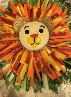 a lion made out of carrots and other vegetables