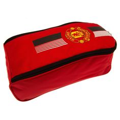 a red bag with the flag of manchester on it's side and black sides