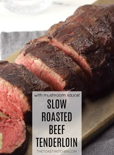 sliced roast beef on a cutting board with text overlay that reads slow roasted beef tenderloin