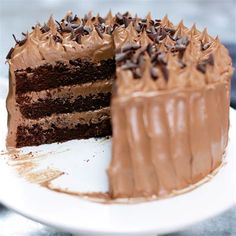 a chocolate cake with one slice missing from it