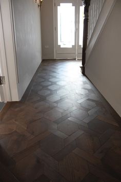 the hallway is clean and ready to be used as a place for an entryway