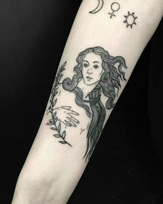 a woman's arm with a tattoo on it and the moon above her head