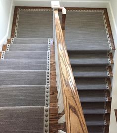 carpeted stairs leading up to the second floor