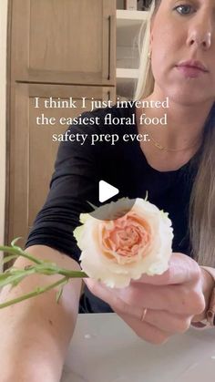 a woman holding a flower in her hand with the caption, i think i just invested the easest floral food safety prep ever