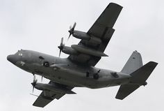 an airplane is flying in the sky with propellers on it's wings and two propeller engines