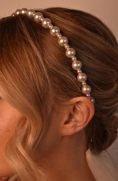 The L. Erickson Studded Pearl Headband is a chic and comfortable headband. Resembling a strand of pearls, this headband is a great choice for any occasion. Elegant and stylish, these pearls will add to your outfit.Product Features:- Imported by L. Erickson- Great for all hair types- Comfortable, easy styling solution- Made of Metal & Faux Pearl- Dimensions: 1/2" wide Elegant Hairstyles With Pearls, Pearl Headband Hairstyles, Wedding Hair With Headband, Pearls In Hair, Pearl Hairband, Pearl Hair Accessories, Pearl Headband Wedding, Strand Of Pearls, Fashion Headbands