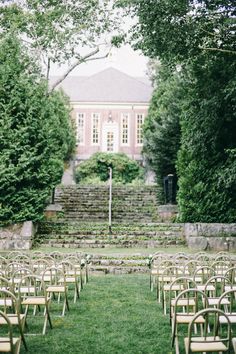 rows of chairs set up in front of a building with steps leading to the top