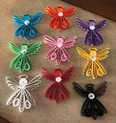 six different colored hair clips in various shapes and sizes