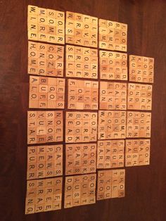 several wooden scrabbles are arranged on a table