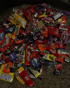 a pile of assorted candy on the floor