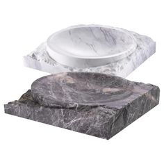 two marble bowls sitting on top of each other