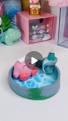 there is a small toy elephant in the water