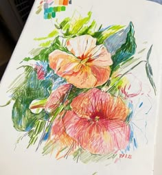 a drawing of some flowers on a piece of paper with colored crayon pencils