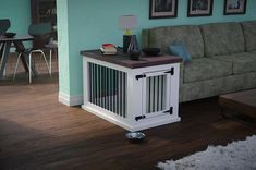 a living room with a couch, coffee table and other items on the floor in front of it