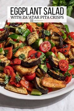 eggplant salad with zaata pita chips on a white plate