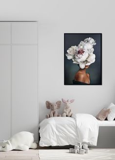 a bedroom with white furniture and flowers on the head