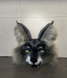 Universal size -- fits everyone! 🎭 The mask is easily adjustable and comfortable to wear on any head size. This unique half-face wolf mask with realistic ears is the perfect choice for those looking for a high-quality and comfortable cosplay accessory. Covered in faux fur, it features details that highlight the natural appearance of a white and gray wolf. 🐺 It's an excellent fit for therians and alterhumans who are looking for a mask to express their theriotype. Lightweight and comfortable, th Novelty Cosplay Eye Mask, Adjustable Masks For Halloween Cosplay, Novelty Eye Mask For Cosplay, Black Novelty Masks For Cosplay, Halloween Cat Ears Mask For Cosplay, Halloween Cat Ears Mask For Costume Party, Themed Black Full Face Masks And Prosthetics, Black Cat Ears Mask For Costume Party, Black Cat Ears Masks For Costume Party