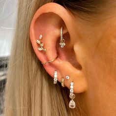 a close up of a person with ear piercings on their left and right sides