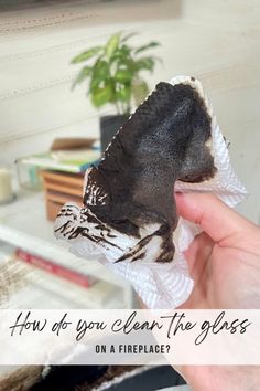 a person holding up a piece of cake with the words how do you clean the glass?