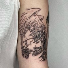 a woman's arm with a black and white tattoo design on the left forearm