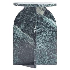 a green marble side table with an oval base