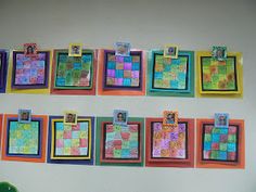 the wall is decorated with colorful pictures and magnets for kids to use on their school's bulletin boards