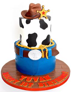 a birthday cake made to look like a cowboy's hat and lasso on top