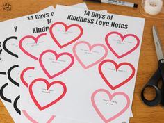 four valentine's day cards with hearts cut out on them next to scissors and thread