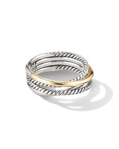 two tone gold and silver ring with twisted design on the outside, set against a white background