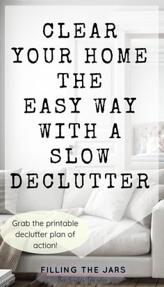 a living room with white furniture and text that reads clear your home the easy way with a slow declutter