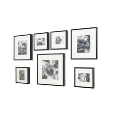 six black and white pictures hanging on the wall with one person's hand holding an object