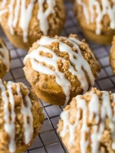 freshly baked muffins with icing on a cooling rack