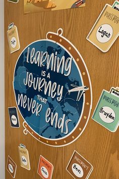 a wooden door with stickers and magnets on it that says learning is a journey that never ends