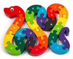 the colorful wooden alphabet puzzles are shaped like a snake