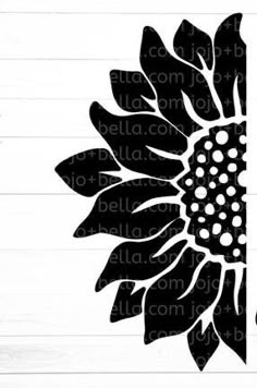 a sunflower on a wooden background with the word i love you in black and white