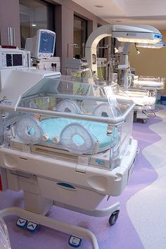 a hospital room filled with lots of medical equipment