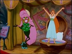 two cartoon characters standing on stage with their arms in the air and one holding her hands up