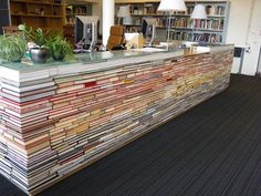 a counter made out of stacks of magazines