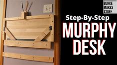 there is a wooden wall hanging with the words step - by - step murphy desk on it