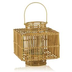 a small bamboo lantern with a handle on the front and side, sitting on a white surface