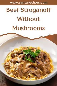 beef stroganoni with mushroom sauce in a white bowl on a wooden table