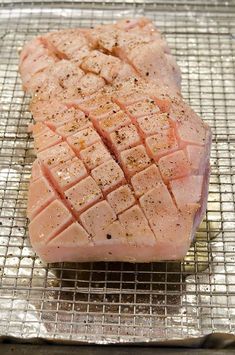 a piece of meat sitting on top of a metal rack