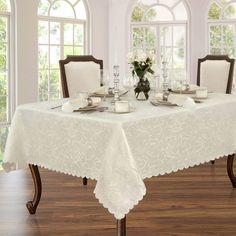 a white table cloth on a dining room table