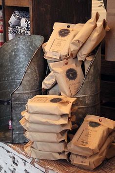 several bags of coffee are stacked on top of each other