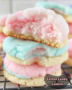 a stack of colorful cookies on top of a cooling rack