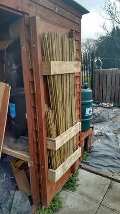 an outhouse with lots of sticks in it