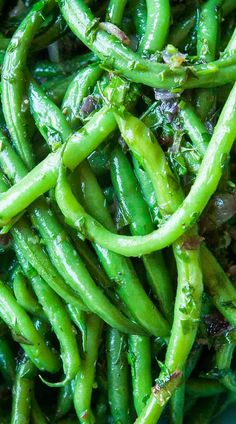 green beans are piled up in a bowl