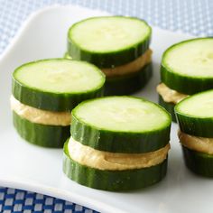 cucumber sandwiches with peanut butter are on a plate